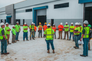 Construction team holding safety meeting on site.